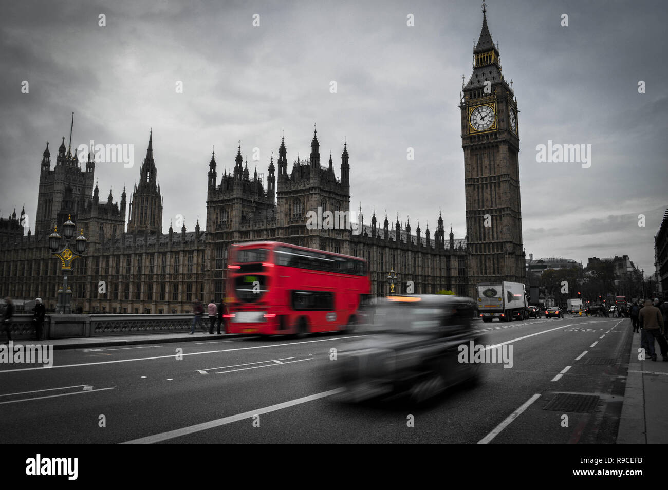 Palace of westminster with moving cars passing by. Stock Photo