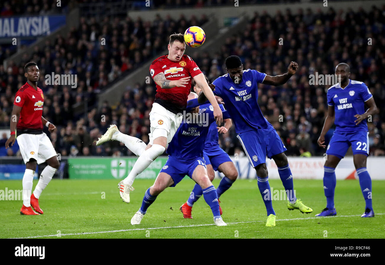 Manchester United's Phil Jones (centre) battles for a header during the Premier League match at the Cardiff City Stadium. PRESS ASSOCIATION Photo. Picture date: Saturday December 22, 2018. See PA story SOCCER Cardiff. Photo credit should read: Nick Potts/PA Wire. RESTRICTIONS: EDITORIAL USE ONLY No use with unauthorised audio, video, data, fixture lists, club/league logos or 'live' services. Online in-match use limited to 120 images, no video emulation. No use in betting, games or single club/league/player publications. Stock Photo