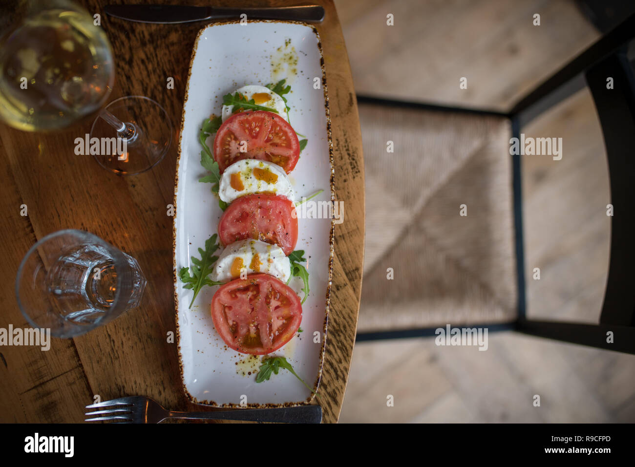 Tomato and Mozzarella on plate Stock Photo