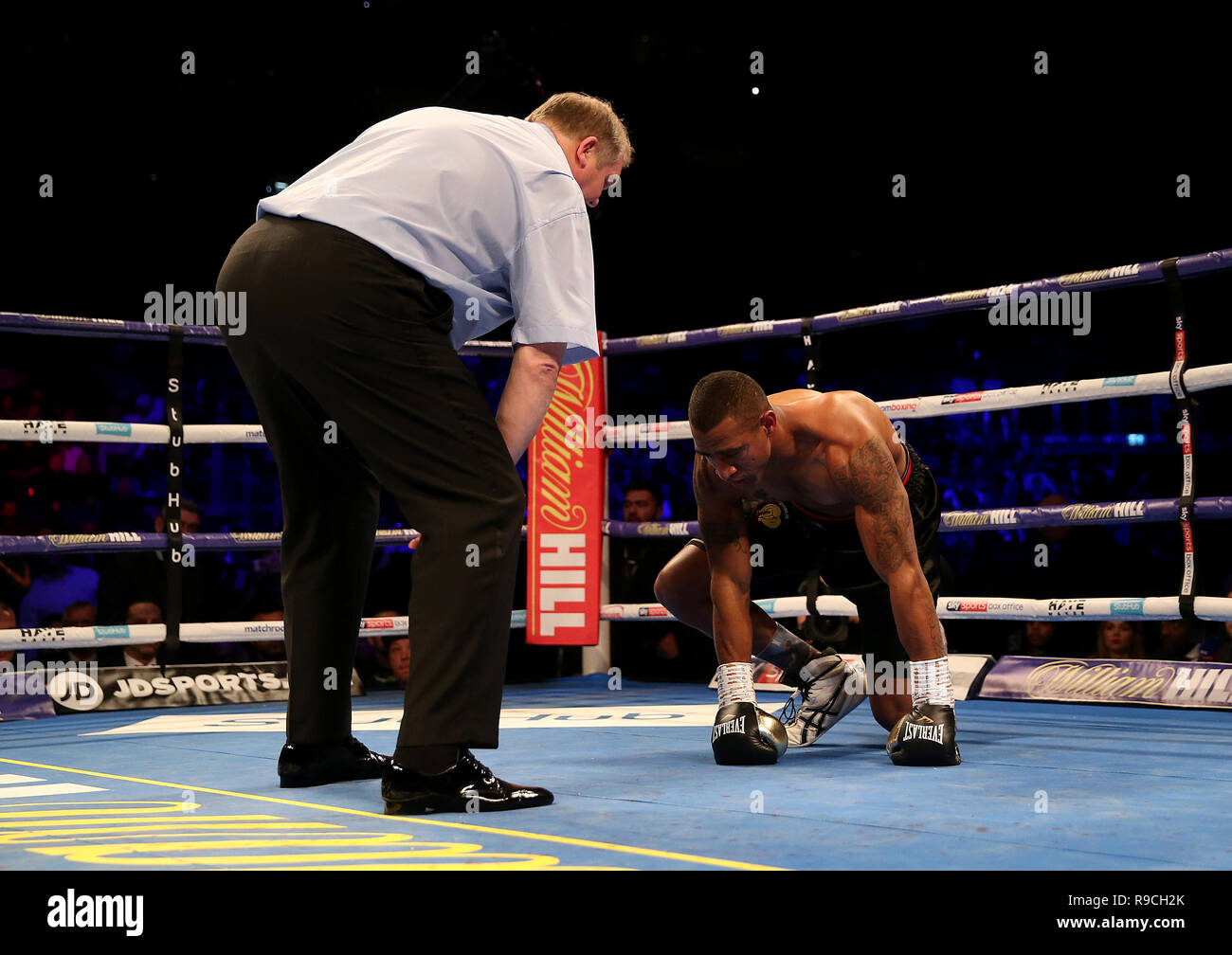 Referee stops the fight in the first round for Renold Quinlan during the WBA International Light-Heavyweight Championship at the O2 Arena, London. Stock Photo