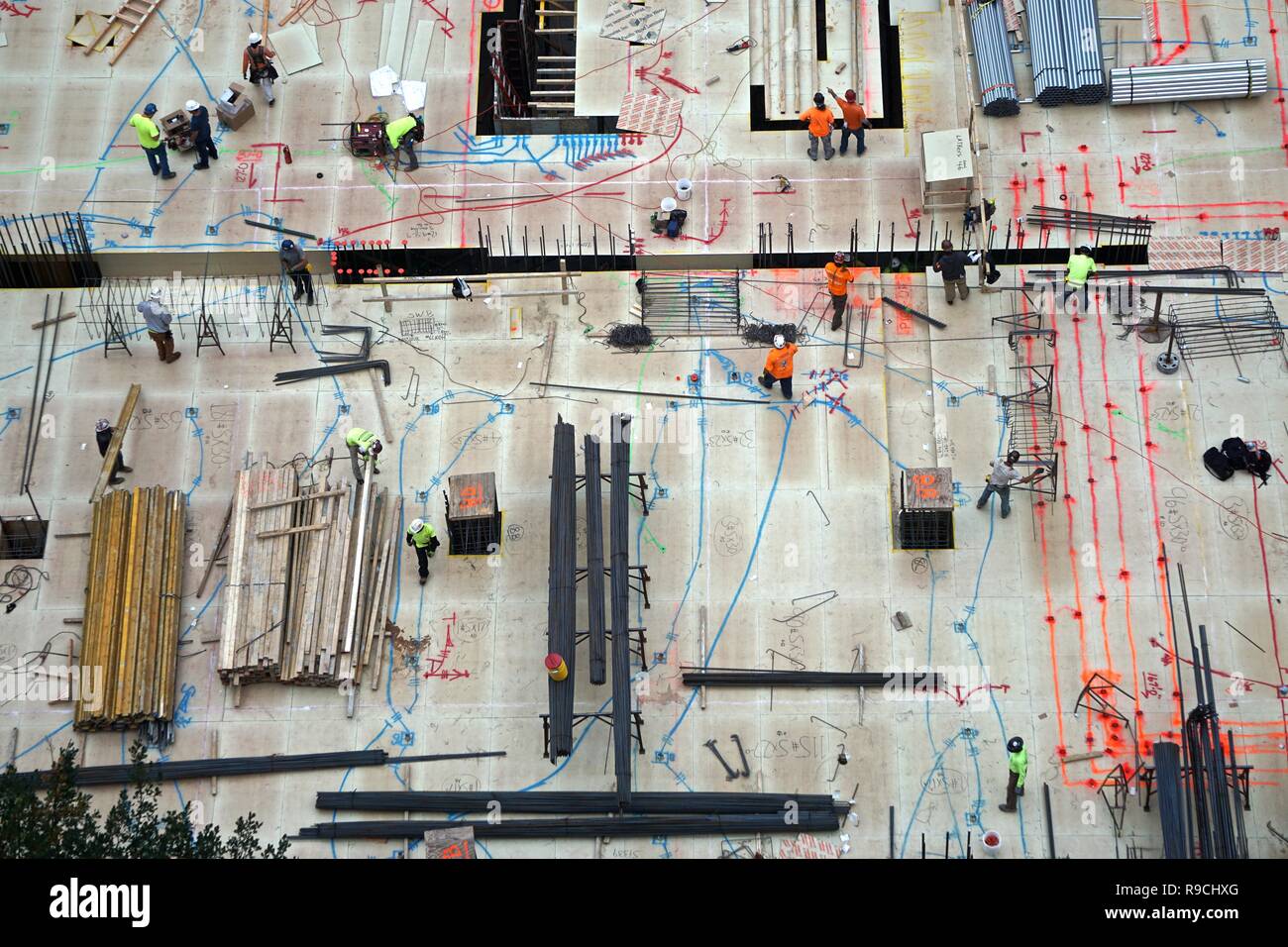 Picture of Aerial view of men and materials during construction of a new high-rise ...