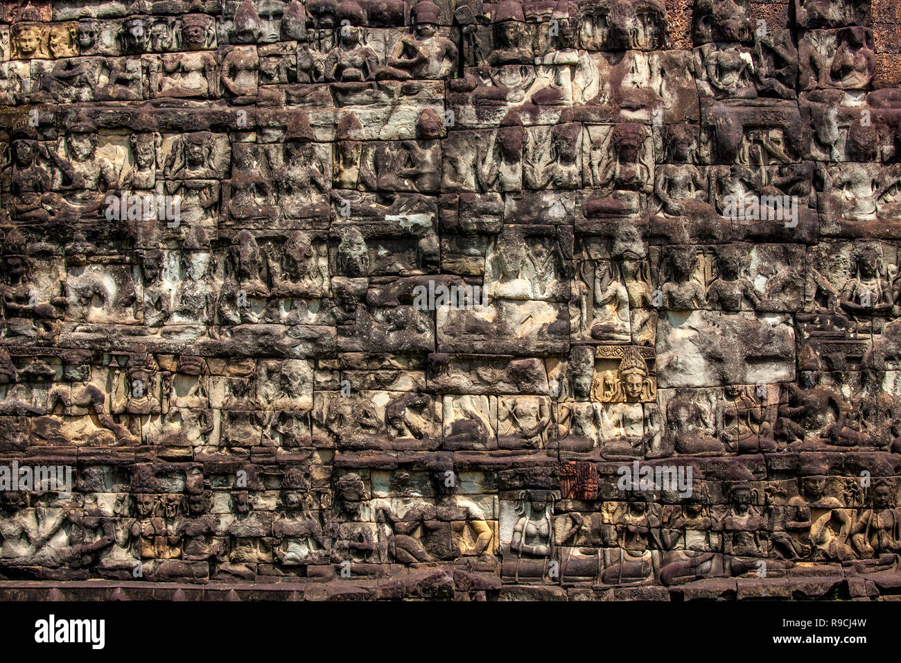 Bas-relief sandstone carvings at the Elephant Terrace Leper King Buddhist ruins at Angkor Thom temple complex in Siem Reap, Cambodia. Stock Photo