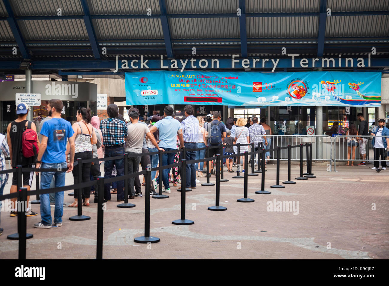 People lined up to buy tickets at The Jack Layton Ferry Terminal. City of Toronto, Ontario, Canada. Stock Photo