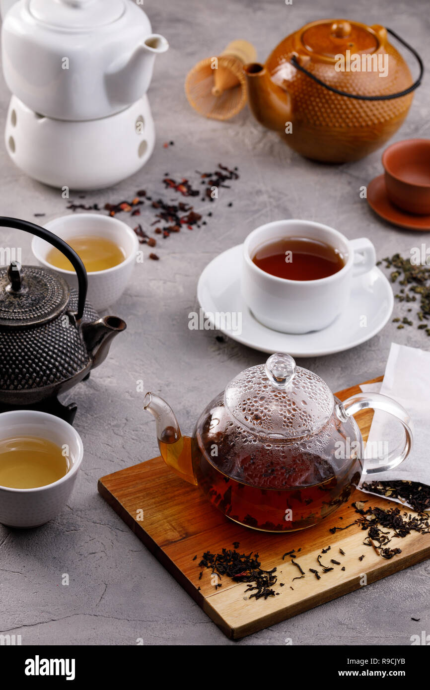 Tea card. Variety of teapots on a gray background, different types of ...