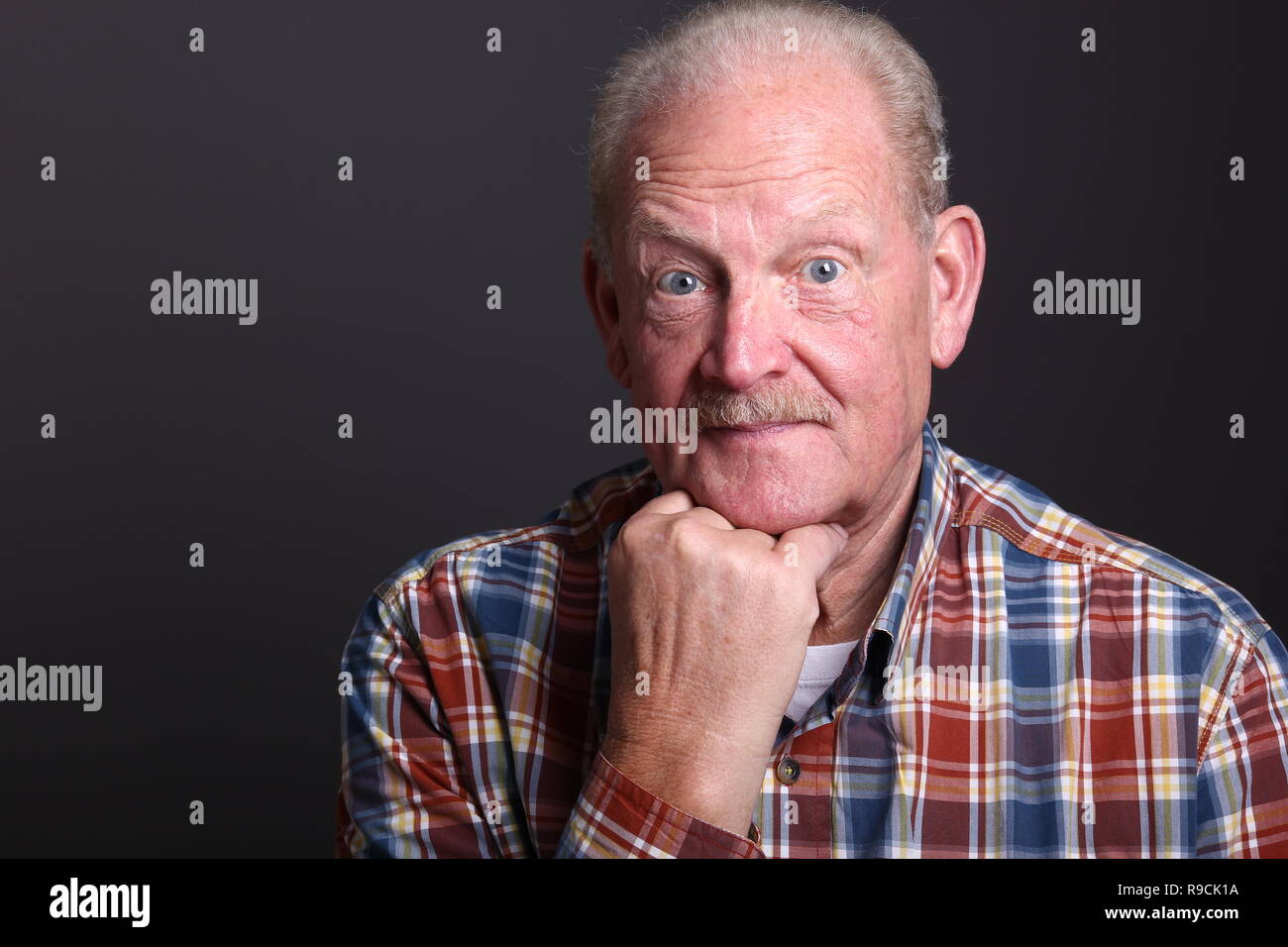 Beautiful old man in front of a background Stock Photo - Alamy