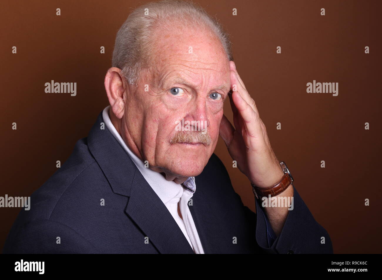 Beautiful old man in front of a background Stock Photo - Alamy