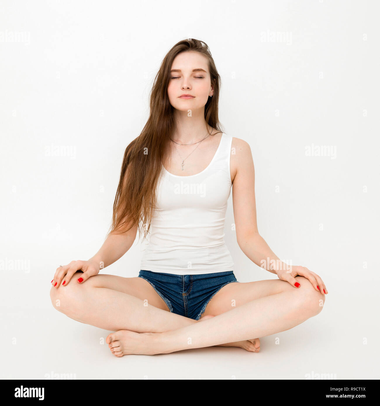 Meditation in the Lotus position. Beautiful girl doing yoga Stock Photo ...