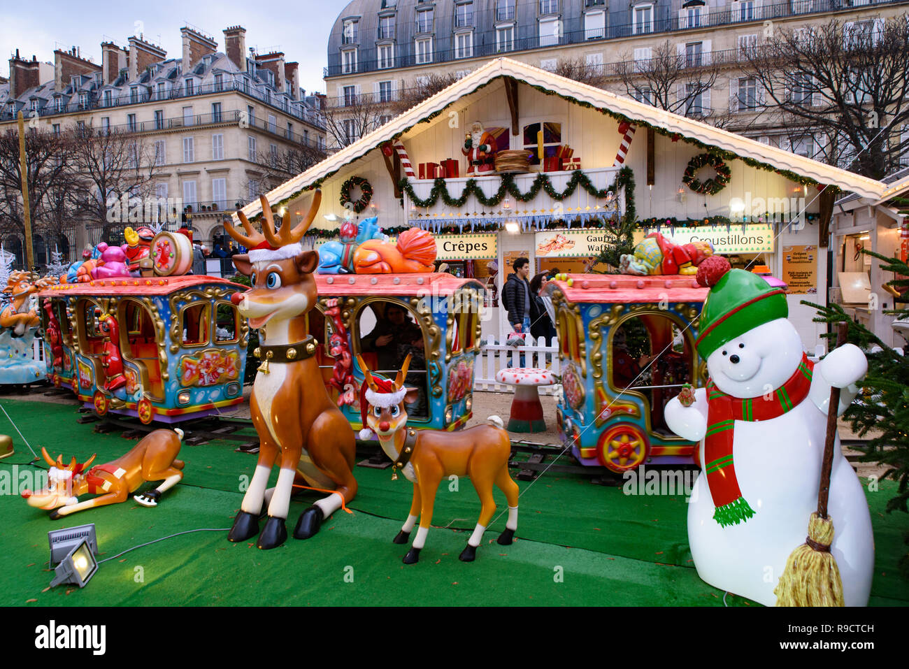 Entertainment ride in Christmas market in Tuileries Gardens, Paris, France Stock Photo