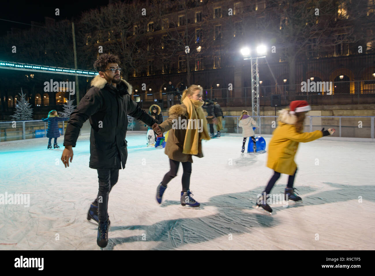 Ice rink in Christmas market in Tuileries Gardens, Paris, France Stock Photo