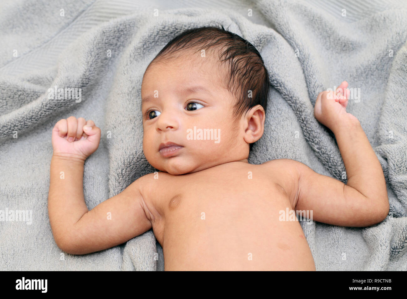 Cheerful Indian newborn baby close up Stock Photo
