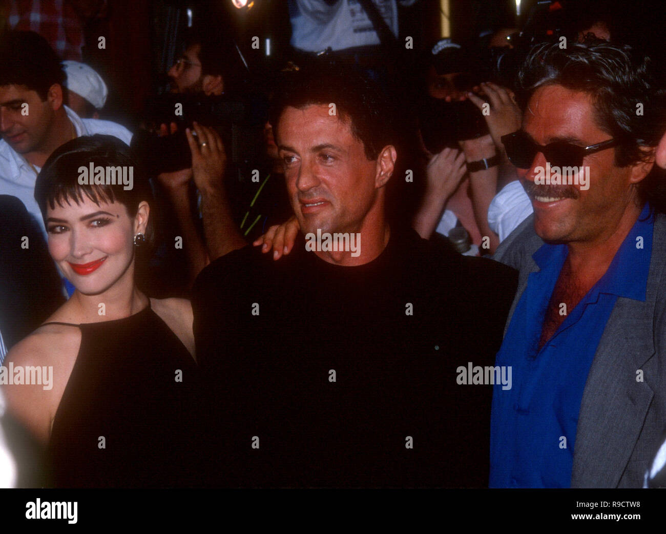 HOLLYWOOD, CA - MAY 26: Actor Sylvester Stallone, actress Janine Turner and producer Mario Kassar attend TriStar Pictures' Cliffhanger' Hollywood Premiere on May 26, 1993 at Mann's Chinese Theatre in Hollywood, California. Photo by Barry King/Alamy Stock Photo Stock Photo