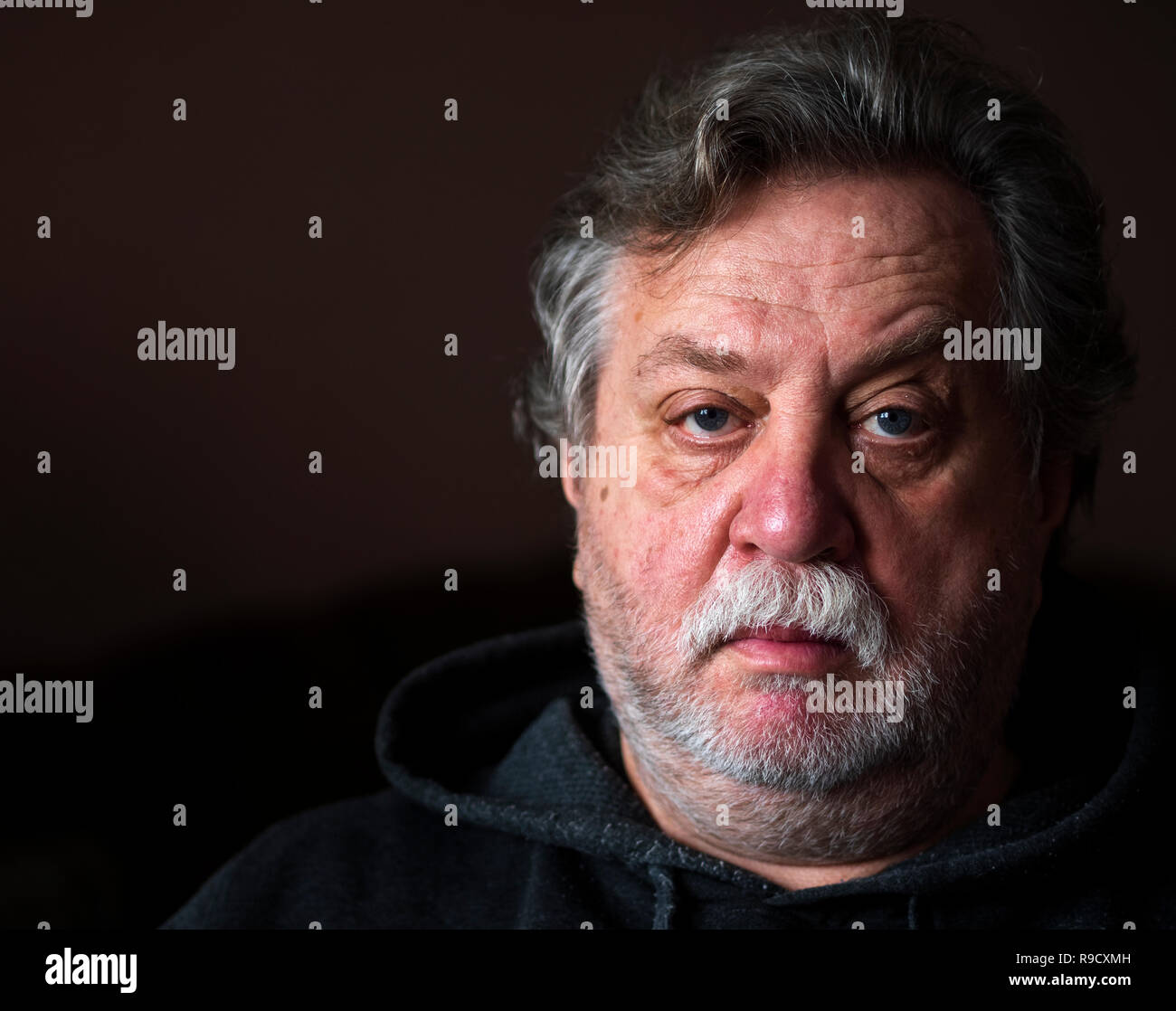 Portrait of Caucasian middle-aged man with a mustache and a beard on his face Stock Photo