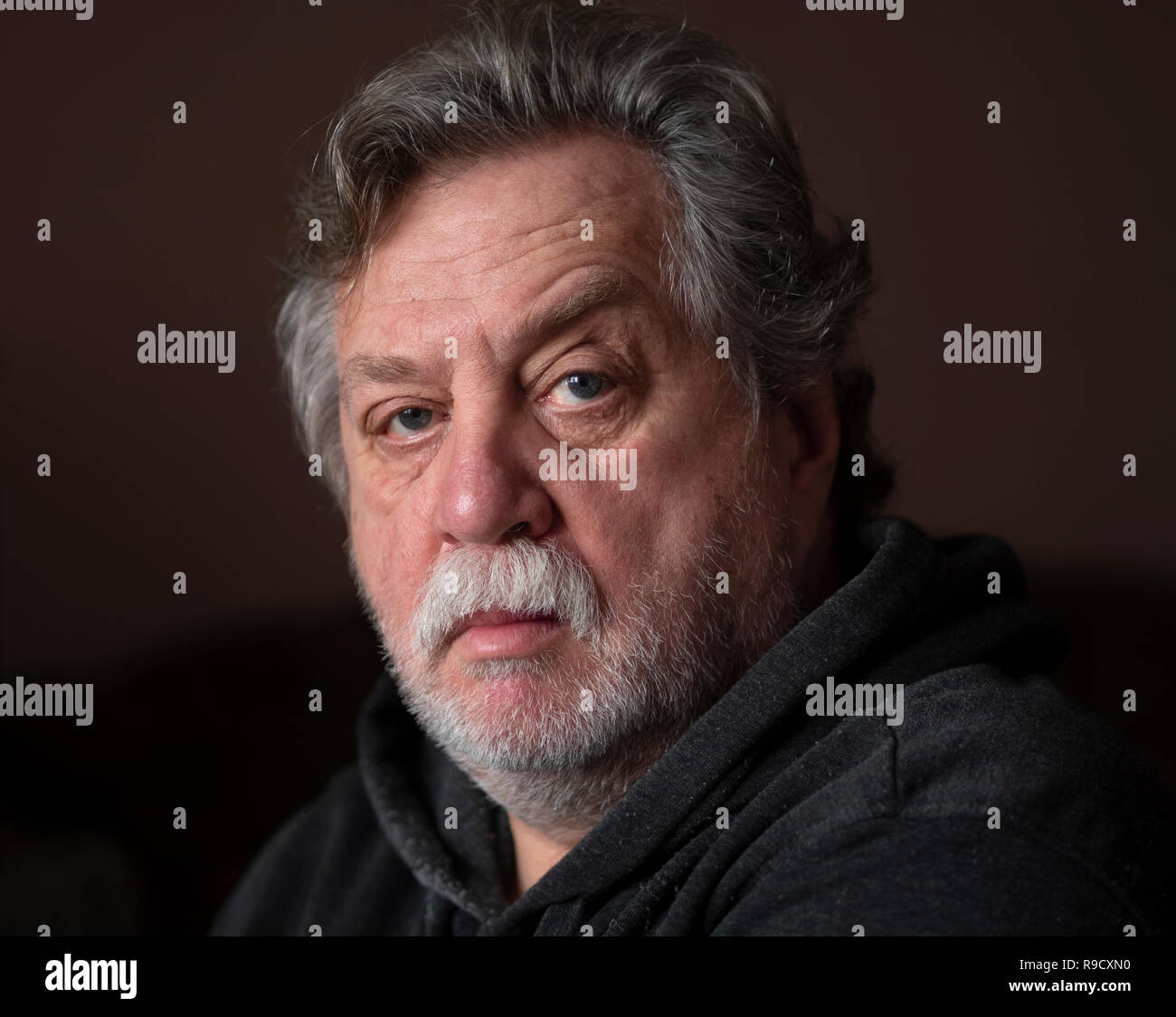 Portrait of Caucasian middle-aged man with a mustache and a beard on his face Stock Photo