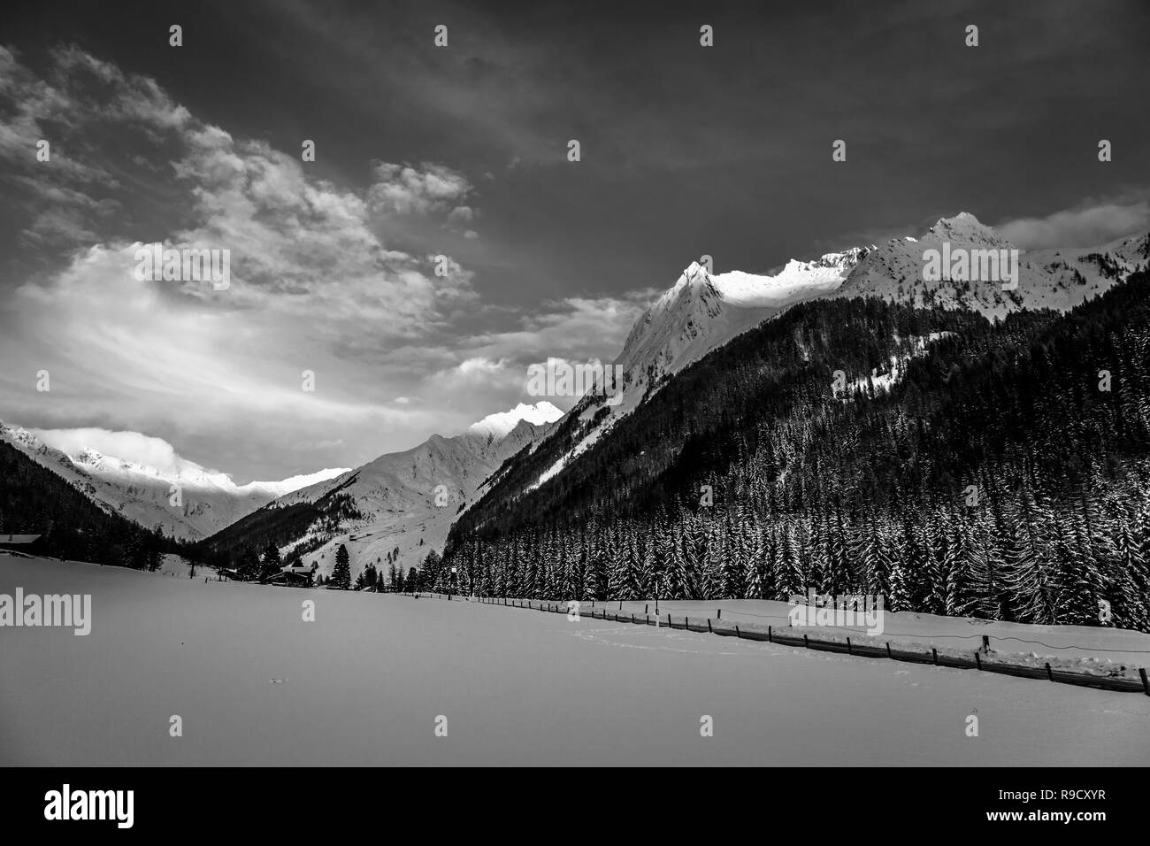 Sun goes down in the alpine valley Stock Photo Alamy