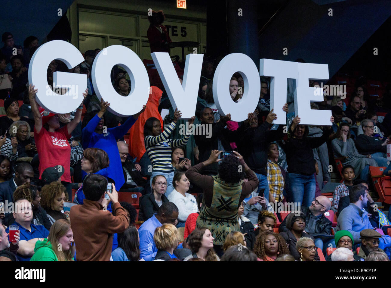 Crowd with a 'Get Out the Vote' sign at pre-election rally on November 4th, 2018 at the UIC Pavilion. Stock Photo