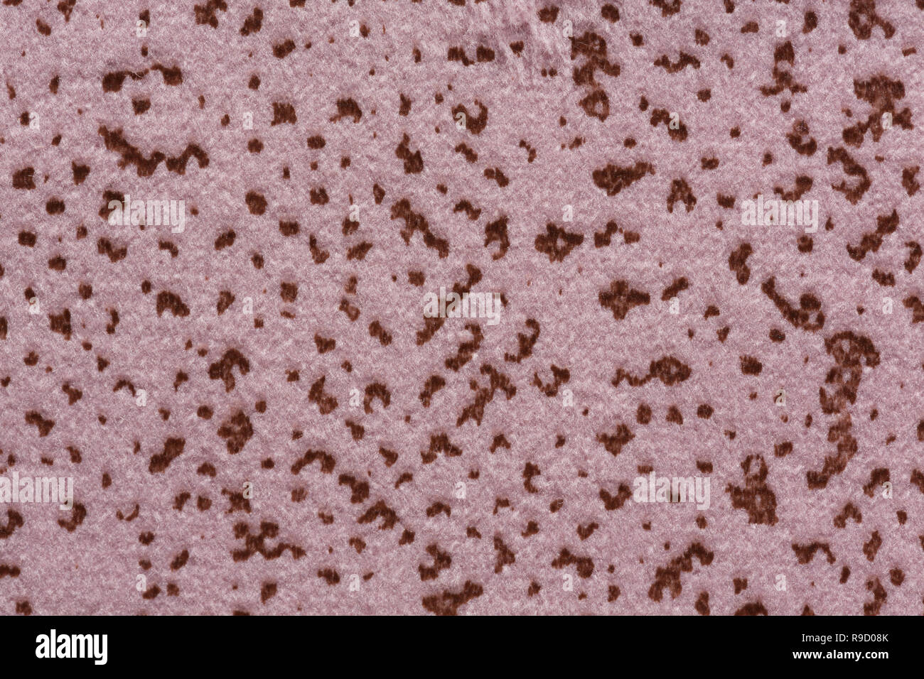 Mottled fabric texture in light brown hue. Stock Photo
