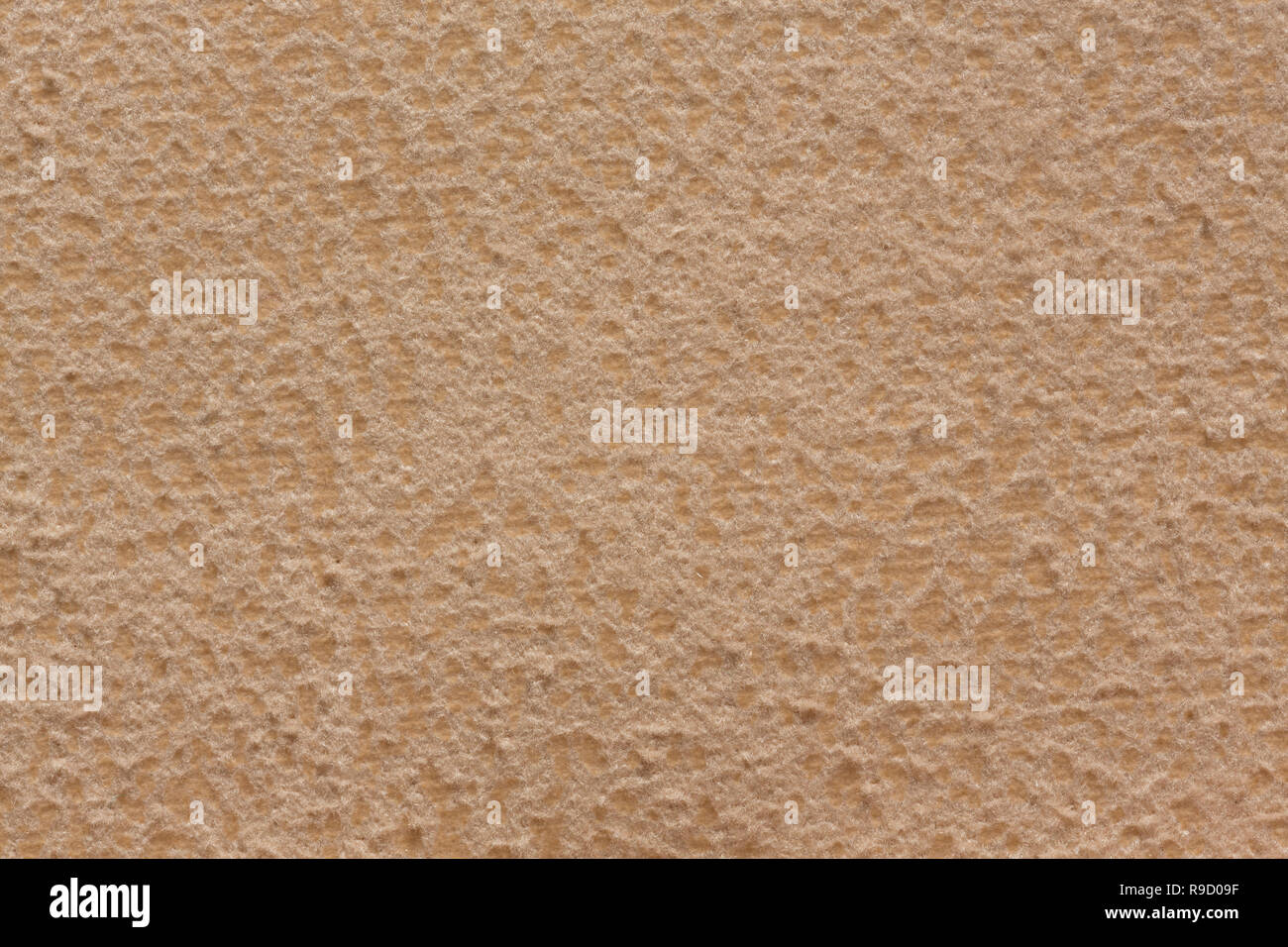 Simple textile background in gentle beige tone. Stock Photo