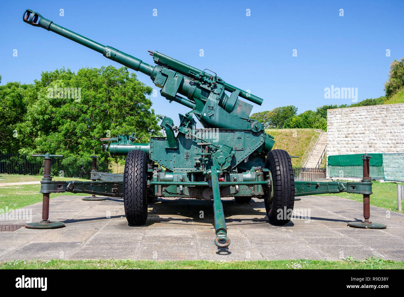 Dover castle, England. World war two anti-aircraft gun on carriage, Vickers QF 3.7 inch mobile gun. Daytime, blue sky. Stock Photo