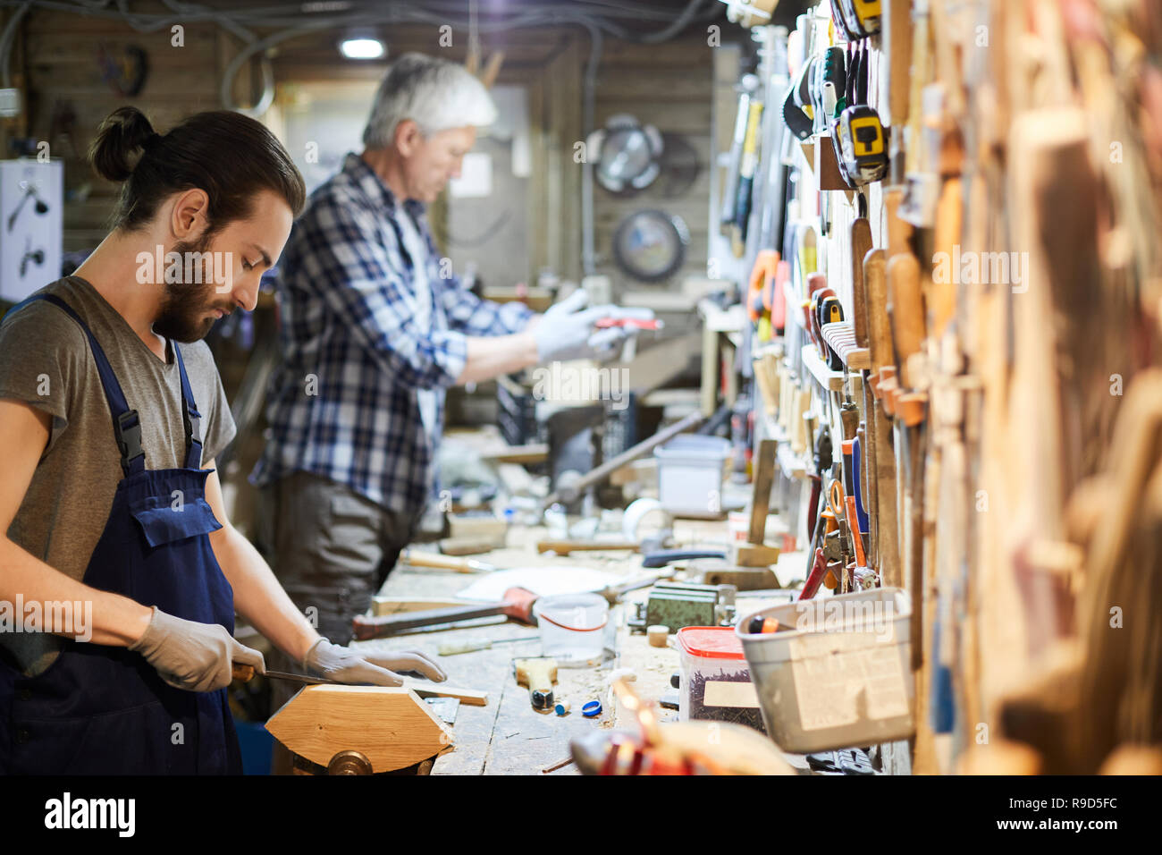 Craftsman artisan processing wood hi-res stock photography and images ...