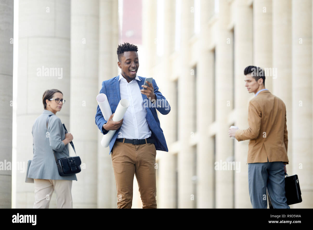 Cheerful engineer talking via video link Stock Photo