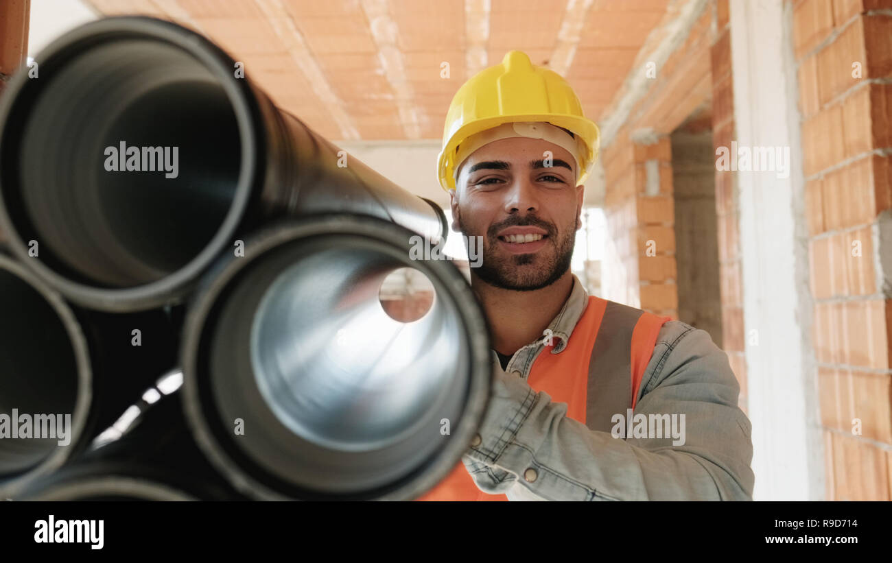 Portrait Of Young Man Working In Construction Site Stock Photo