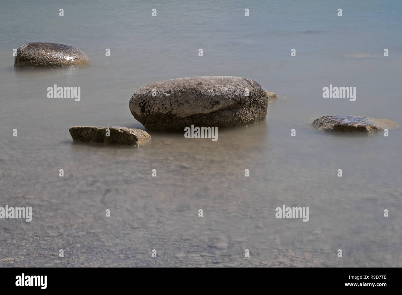 rocks in shallow water Stock Photo