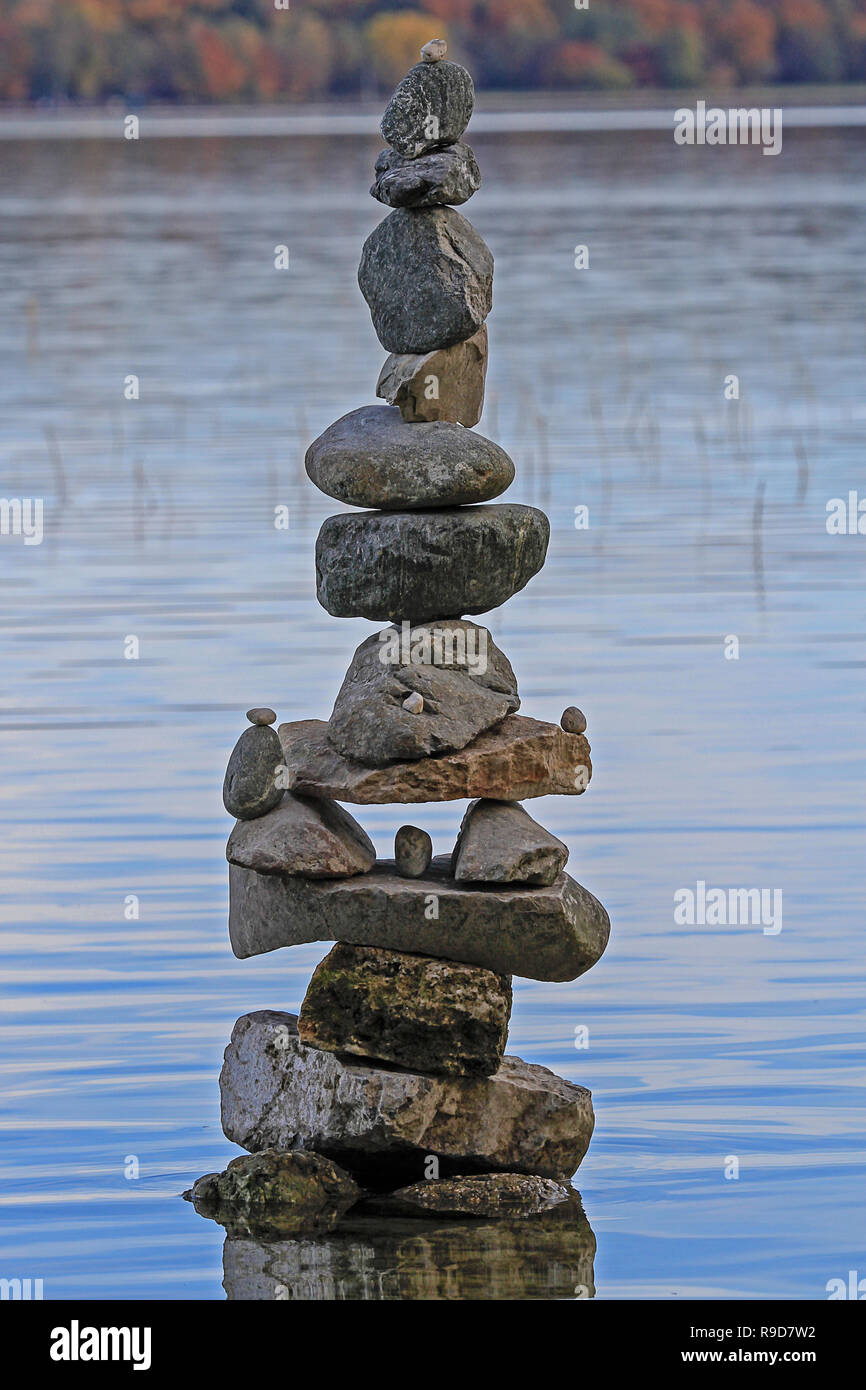 tower of stones in shallow waters Stock Photo