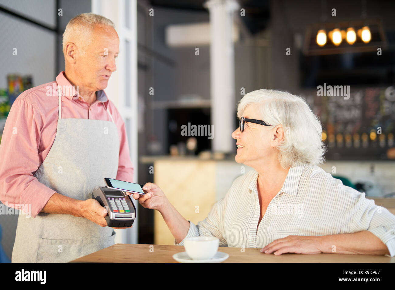 Paying after eating Stock Photo Alamy