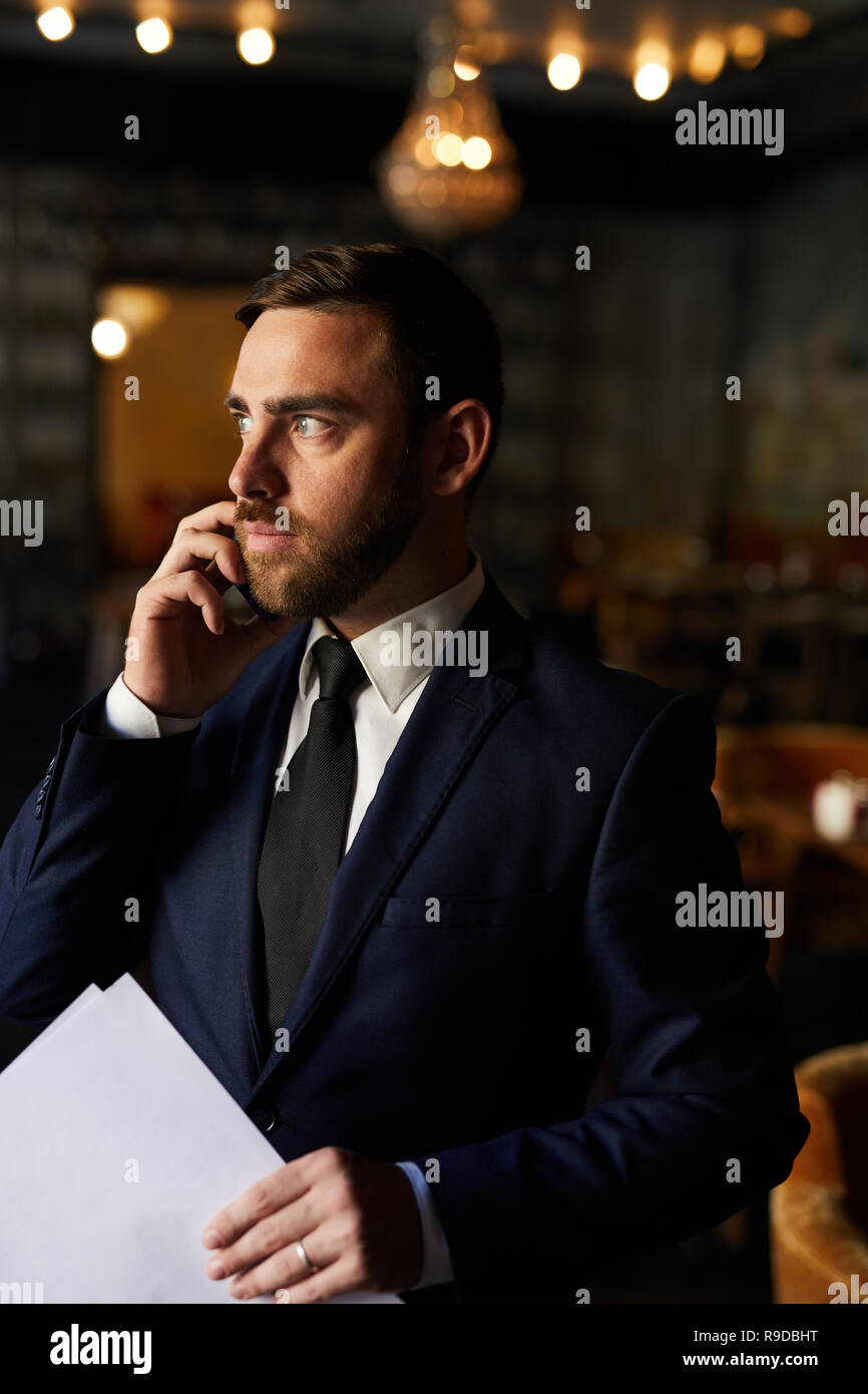 Discussing deal on phone Stock Photo Alamy