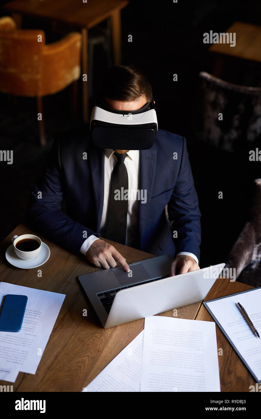 Modern businessman using VR headset Stock Photo
