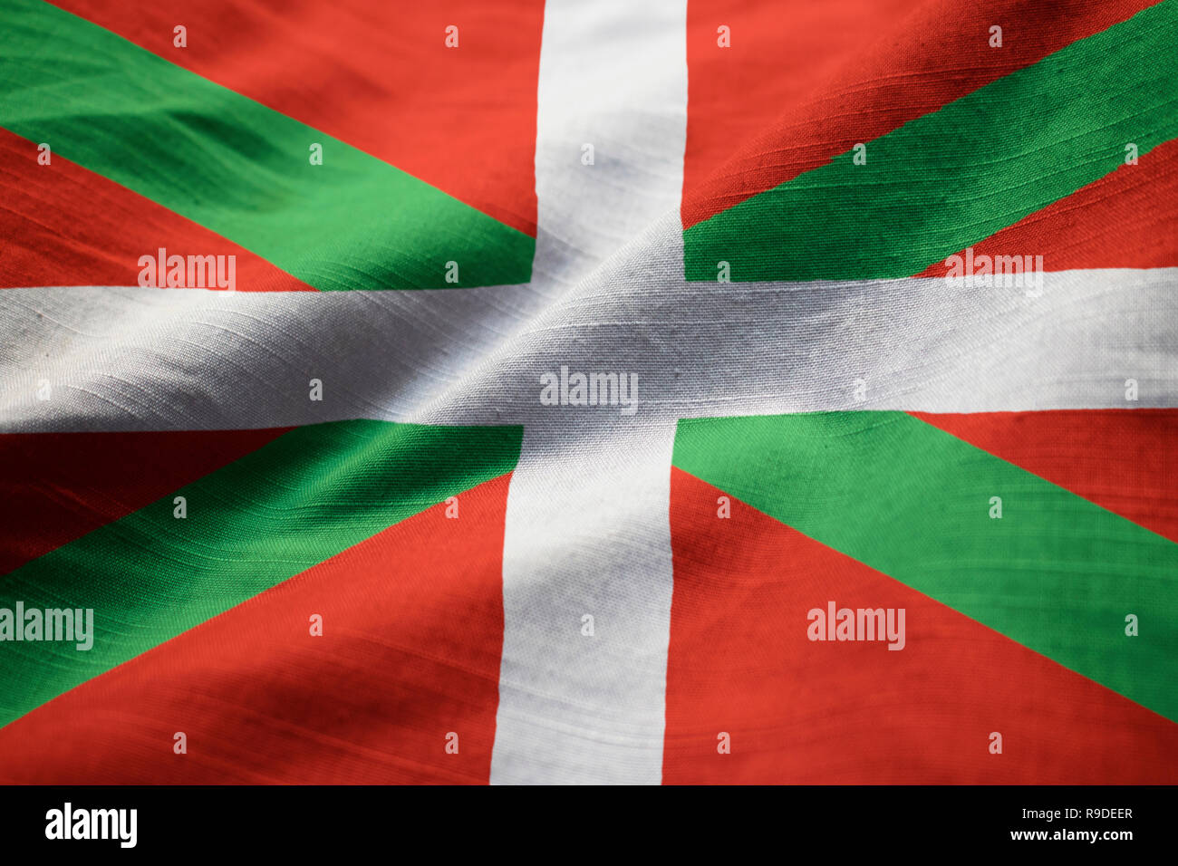 Closeup of Ruffled Basque Country Flag, Basque Country Flag Blowing in Wind Stock Photo