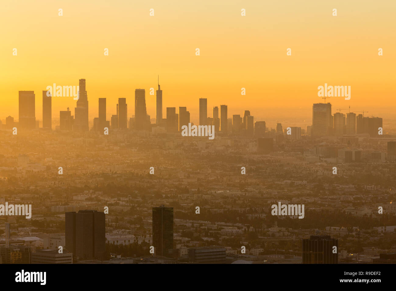Los Angeles California orange sunrise cityscape view.  Shot taken hilltop in the Santa Monica Mountains. Stock Photo
