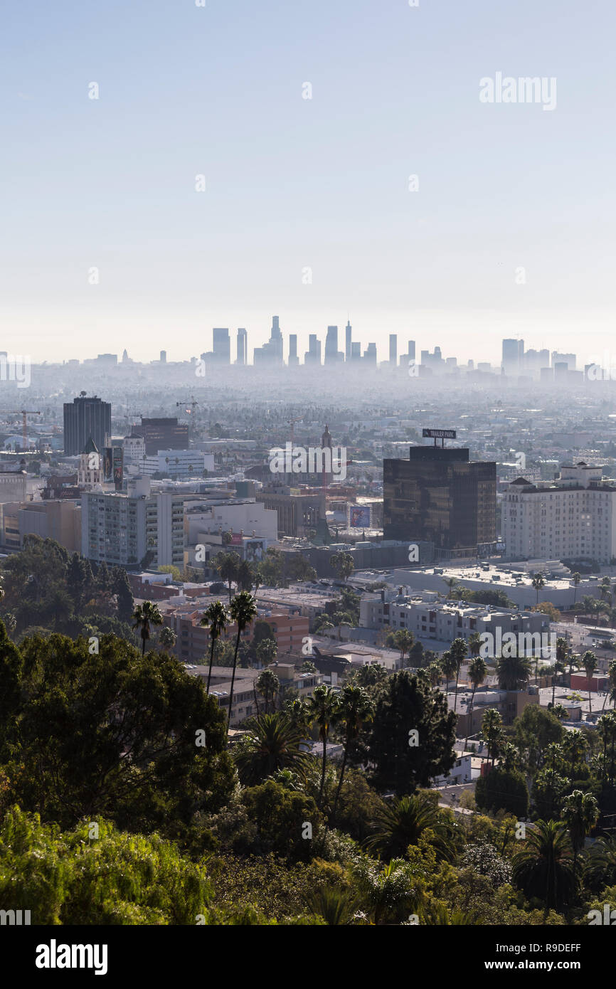 Los Angeles, California, USA - December 16, 2018:  Vertical morning cityscape view towards Hollywood and downtown LA from hiking trail at Runyon Canyo Stock Photo