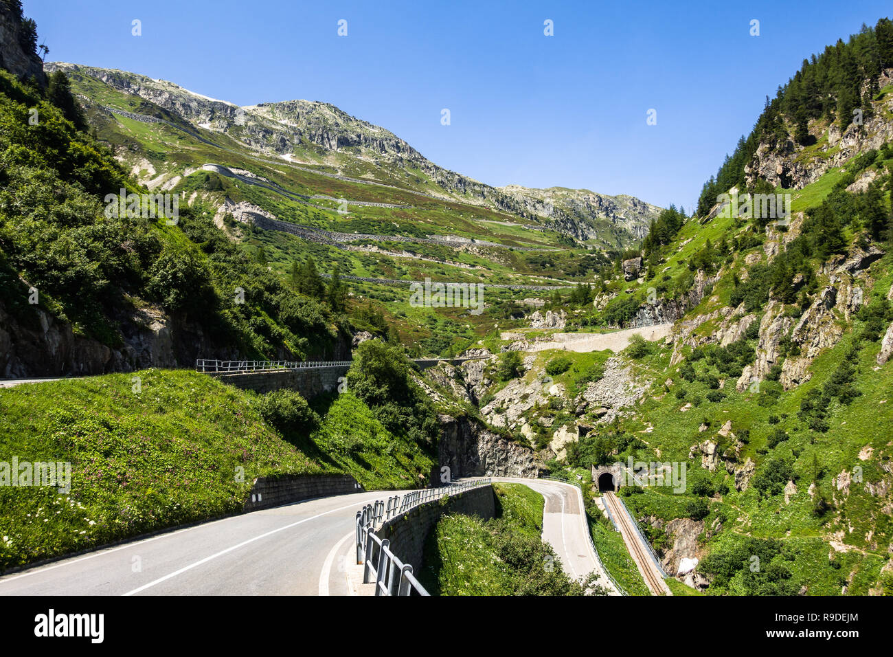 Hairpin and serpentine road to Grimsel Pass (2.164 m) viewed from Upper Valais near Gletsch, Switzerland Stock Photo