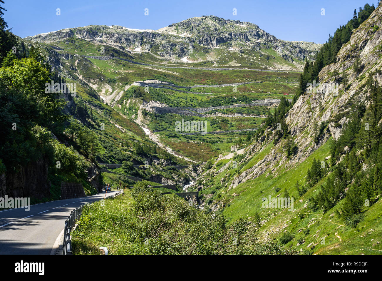 The road to Grimsel Pass (2.164 m) viewed from Upper Valais near Gletsch, Switzerland Stock Photo