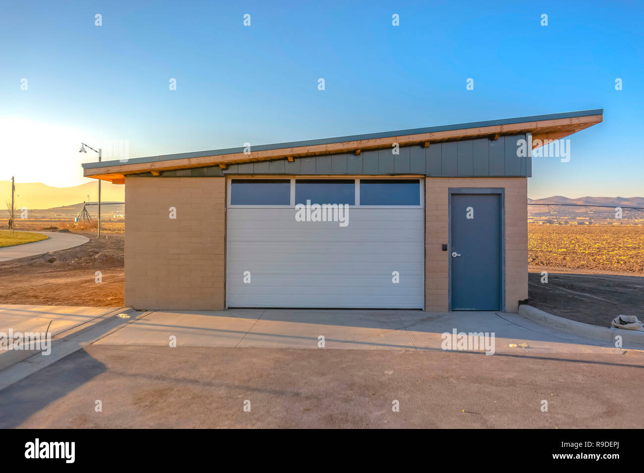 Baseball Field Utility Building With Garage Door Stock Photo
