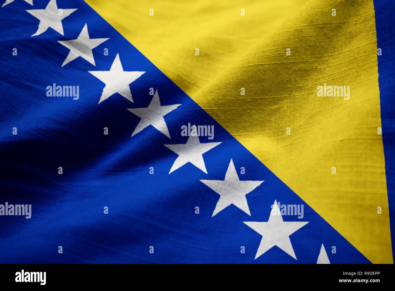 Closeup of Ruffled Bosnia and Herzegovina Flag, Bosnia and Herzegovina Flag Blowing in Wind Stock Photo