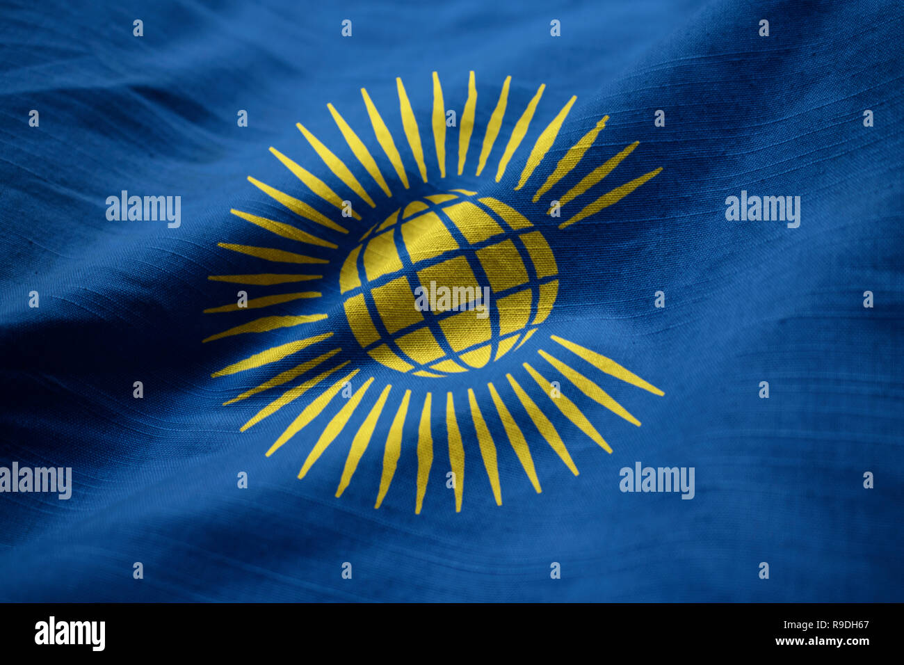Closeup of Ruffled Commonwealth Flag, Commonwealth Flag Blowing in Wind Stock Photo