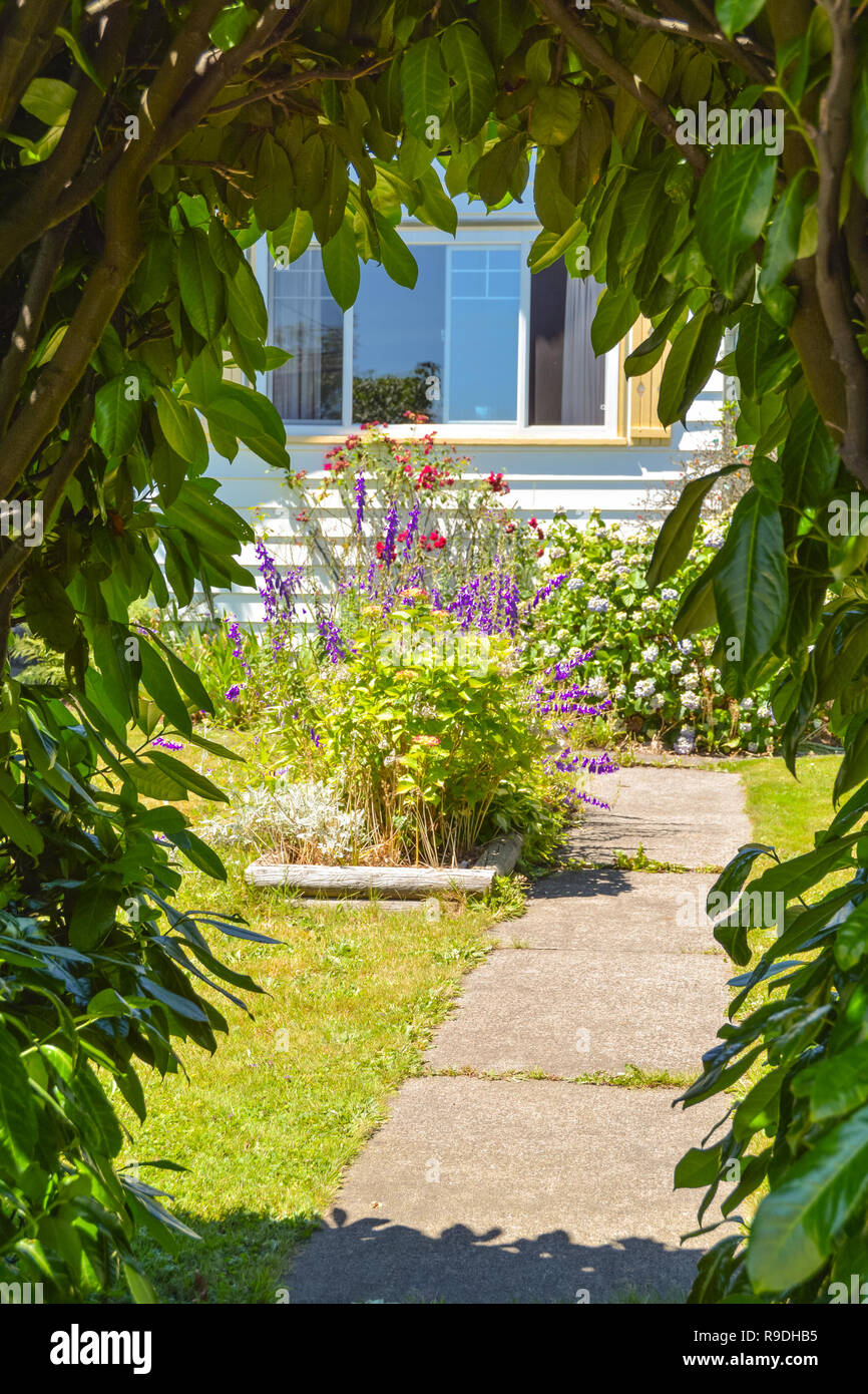 Look through the green gate on the pathway leading to a house with