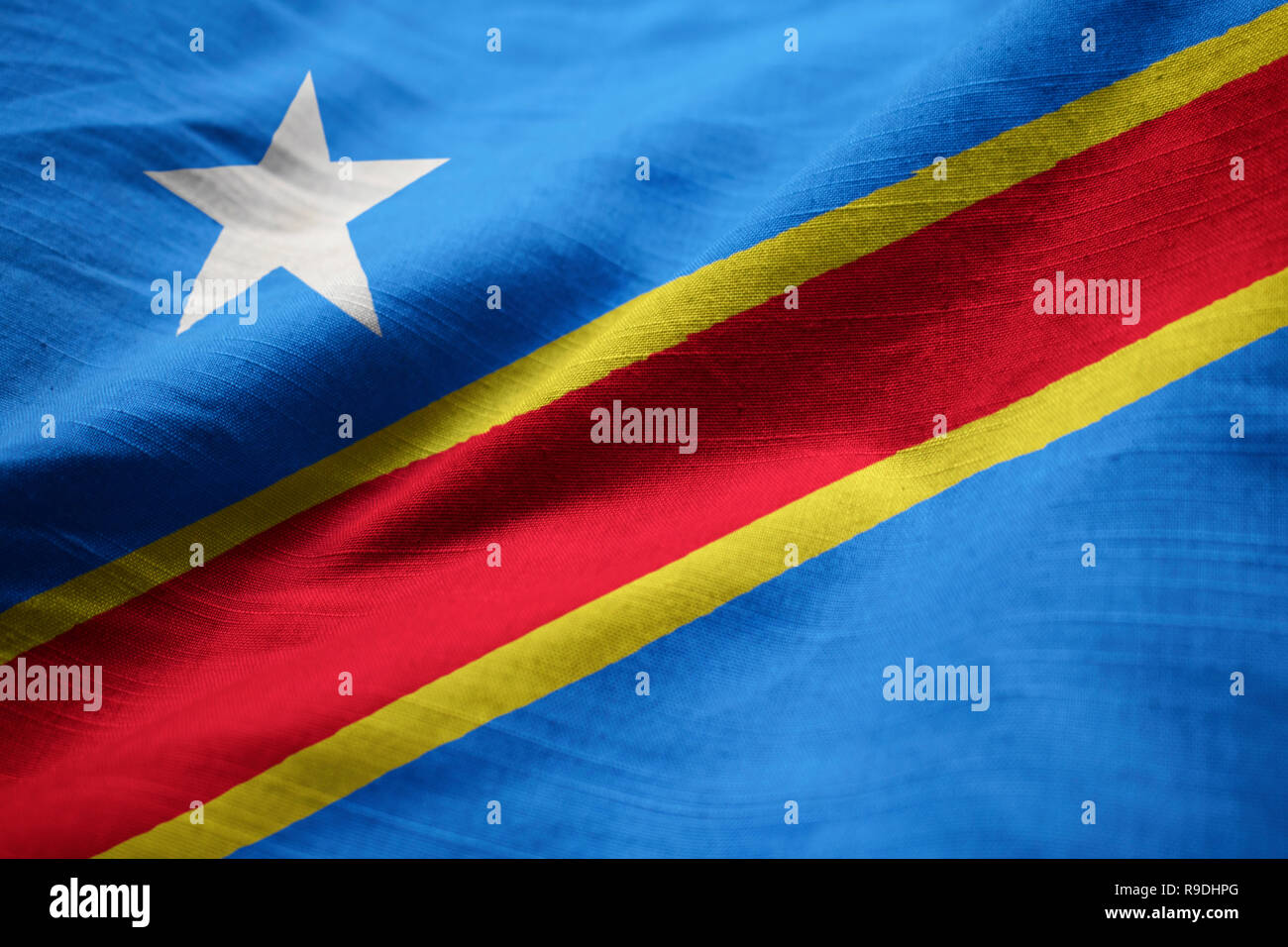 Closeup of the Ruffled Democratic Republic of the Congo Flag, the Democratic Republic of the Congo Flag Blowing in Wind Stock Photo
