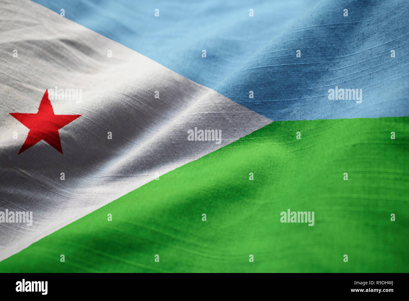 Closeup of Ruffled Djibouti Flag, Djibouti Flag Blowing in Wind Stock Photo