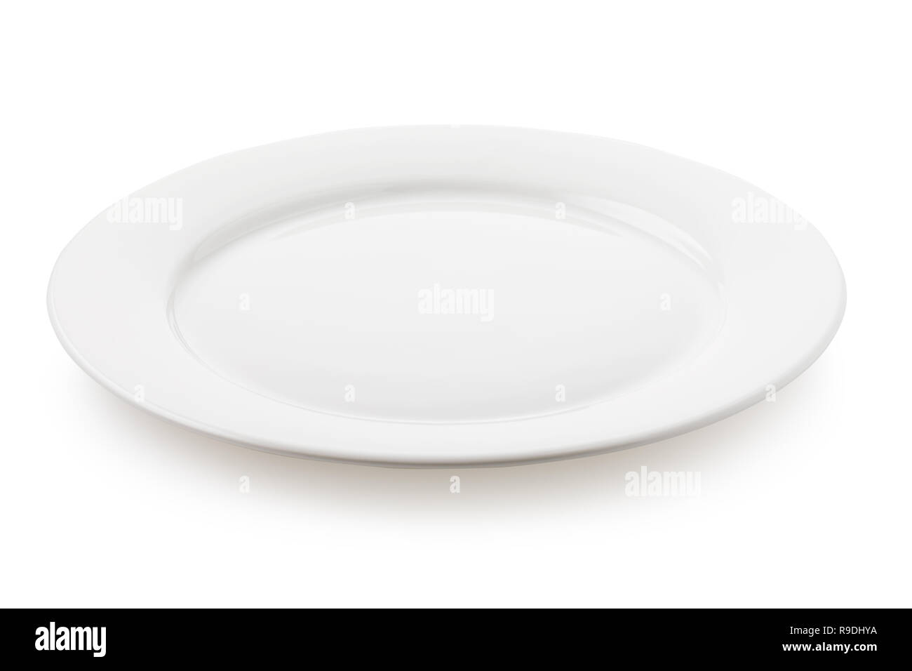 Empty ceramic plate white color, a side view of the isolated object Stock Photo