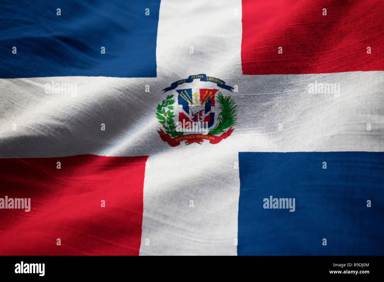 Closeup of Ruffled Dominican Republic Flag, Dominican Republic Flag Blowing in Wind Stock Photo