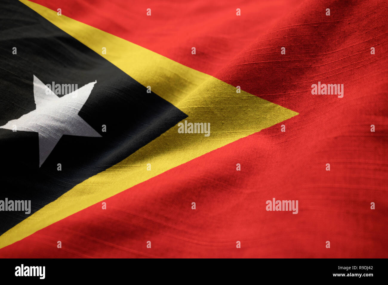 Closeup of Ruffled East Timor Flag, East Timor Flag Blowing in Wind Stock Photo