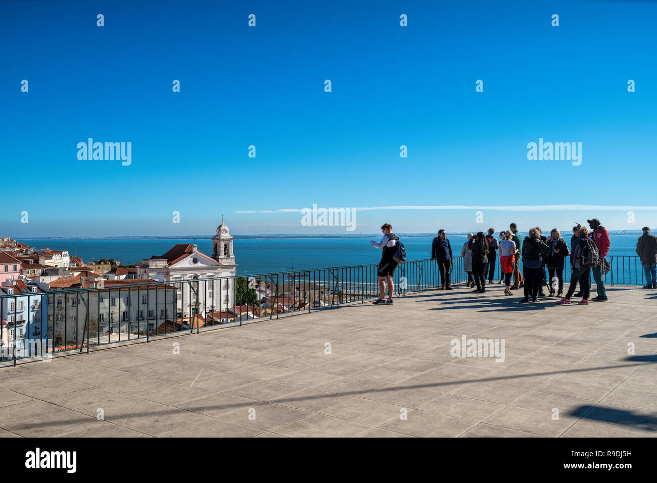 viewpoint and open air terrace  in Lisbon, Portugal. Rooftop view of Alfama old town historical district on summer time. Beautiful place for dinner lu Stock Photo