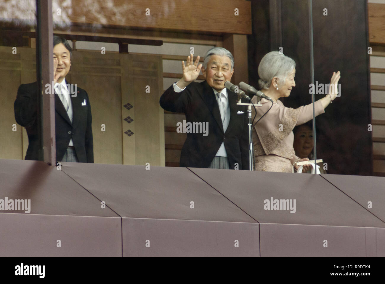 Tokyo, Japan. 23rd Dec, 2018. Emperor Akihito of Japan (C) accompanied by his wife Empress Michiko and his son Crown Prince Naruhito (L), wave to well-wishers during his 85th birthday celebration at the Imperial Palace. People gather to celebrate Akihito's birthday at the Imperial Palace, his last in his 30-year reign. Akihito is set to abdicate next April 30, to be succeeded by his eldest son, Crown Prince Naruhito, on May 1. Credit: Rodrigo Reyes Marin/ZUMA Wire/Alamy Live News Stock Photo
