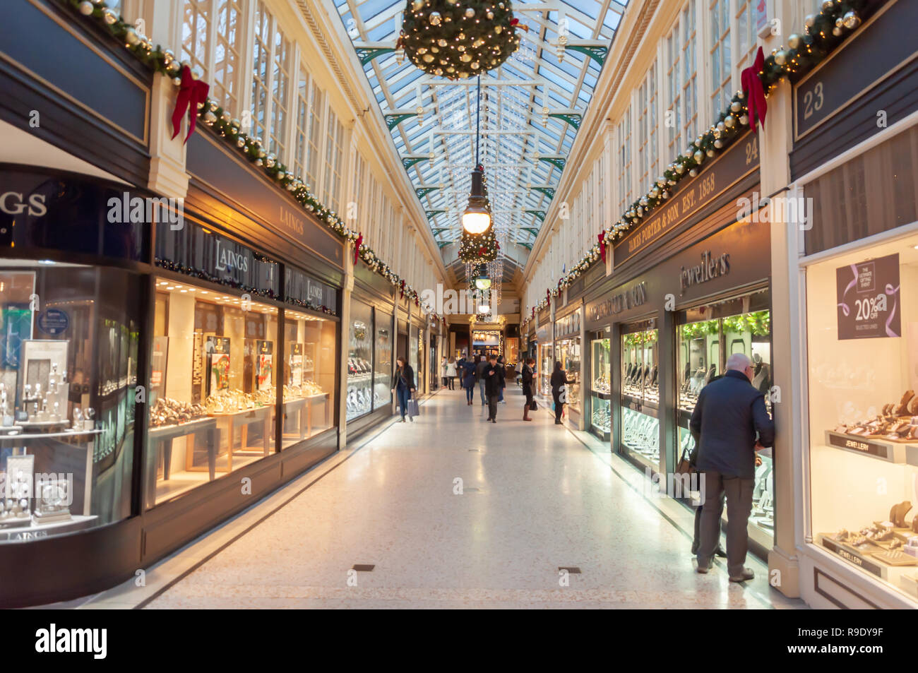 Glasgow, Scotland, UK. 23rd December, 2018. Christmas shoppers in Argyll Arcade which contains a large selection of jewellery shops. The Arcade was designed by John Baird and built in 1827, it is L-shaped and links Argyle Street with Buchanan Street. The arcade was Grade A listed in 1970. Credit: Skully/Alamy Live News Stock Photo
