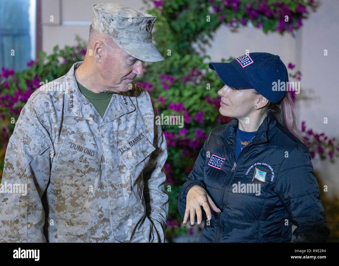 Manama, Bahrain. 21st Dec, 2018. Comedian Jessiemae Peluso chats with Chairman of the Joint Chiefs Gen. Joseph Dunford during the Joint Chiefs USO Christmas Show for deployed service members at Naval Support Activity Bahrain December 22, 2018 in Manama, Bahrain. This year’s entertainers include actors Milo Ventimiglia, Wilmer Valderrama, DJ J Dayz, Fittest Man on Earth Matt Fraser, 3-time Olympic Gold Medalist Shaun White, Country Music Singer Kellie Pickler, and comedian Jessiemae Peluso. Credit: Planetpix/Alamy Live News Stock Photo