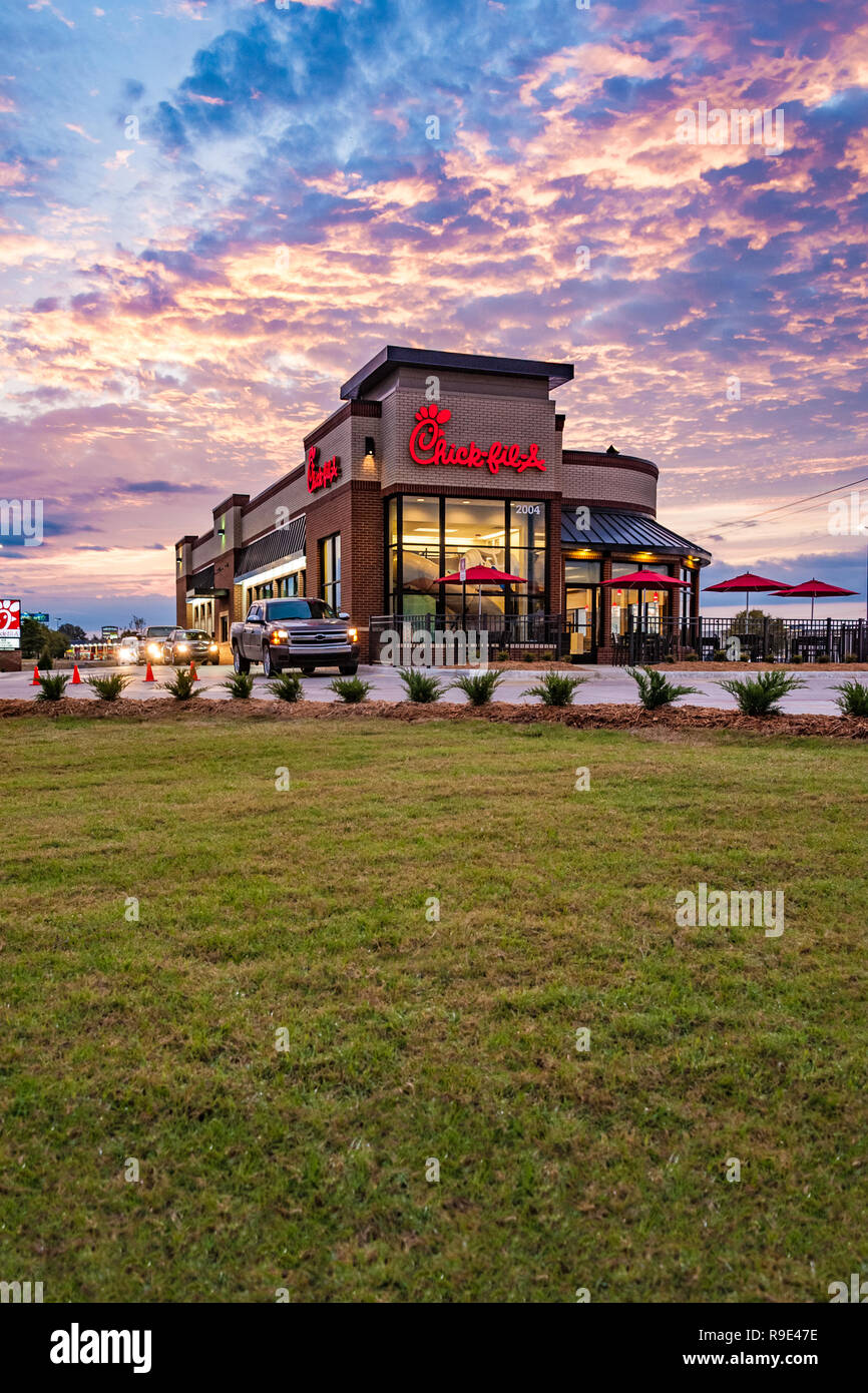 Breakfast drive-thru traffic at Chick-fil-A in Muskogee, Oklahoma at sunrise. Stock Photo