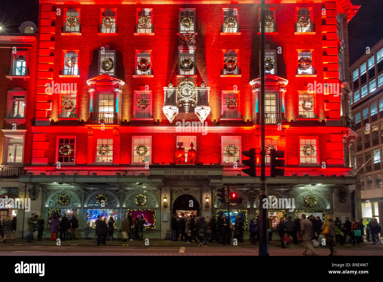 The famous Fortnum & Mason store lit up in red for Christmas Stock